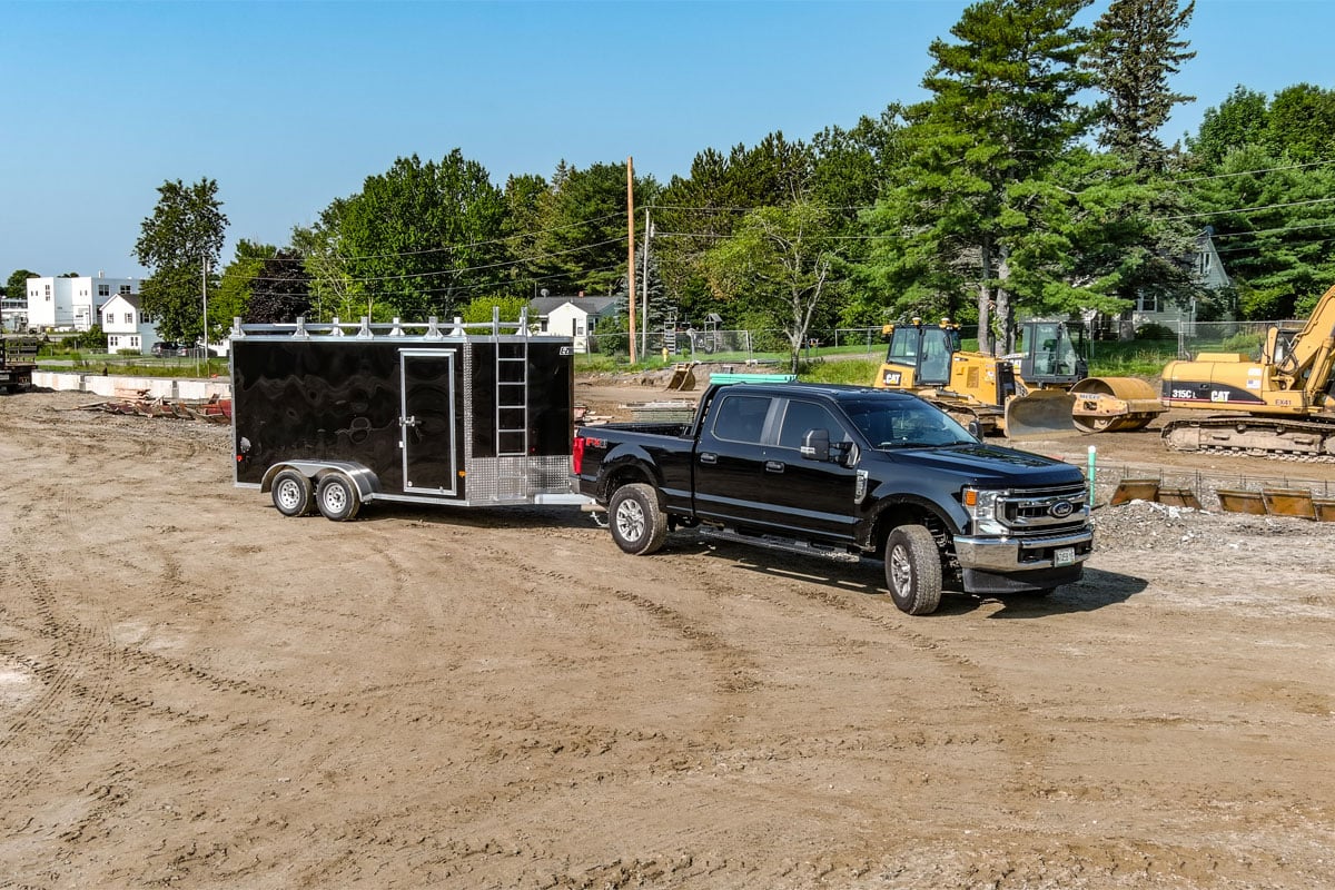 black-truck-towing-black-trailer